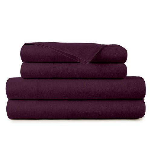 Brushed organic cotton flannel sheet set in natural on a made bed