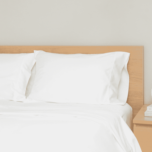 GOTS-certified organic cotton sateen pillowcases on stacked pillows