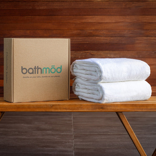 Two oversized GOTS-certified organic cotton bath sheets in plush terry